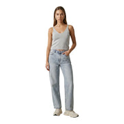 Light-wash denim jeans with straight-leg cut and classic five-pocket design paired with light blue glitter shina strap top