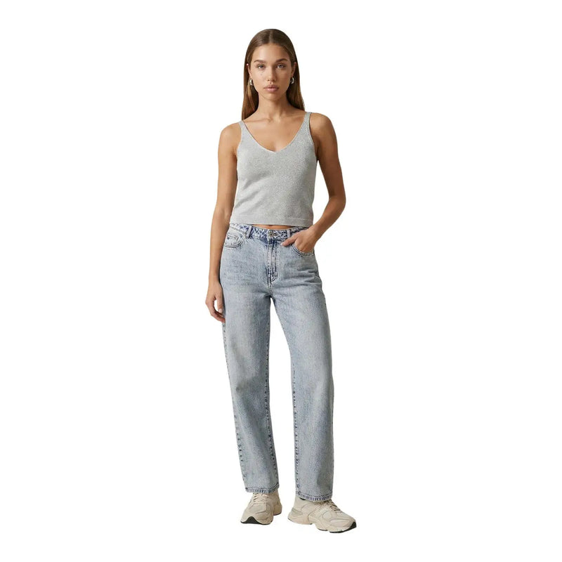 Light-wash denim jeans with straight-leg cut and classic five-pocket design paired with light blue glitter shina strap top