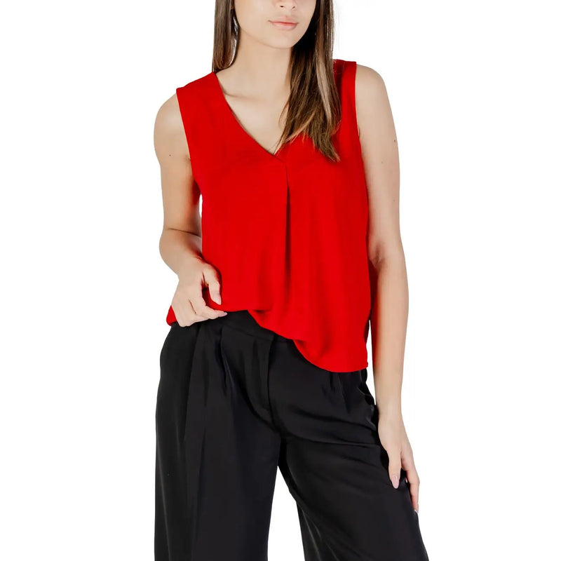 A vibrant red sleeveless women tank top with a v neckline made of soft flowing polyester fabric