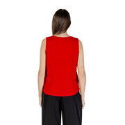 A vibrant red sleeveless polyester tank top for women with a v neck and smooth fitted silhouette