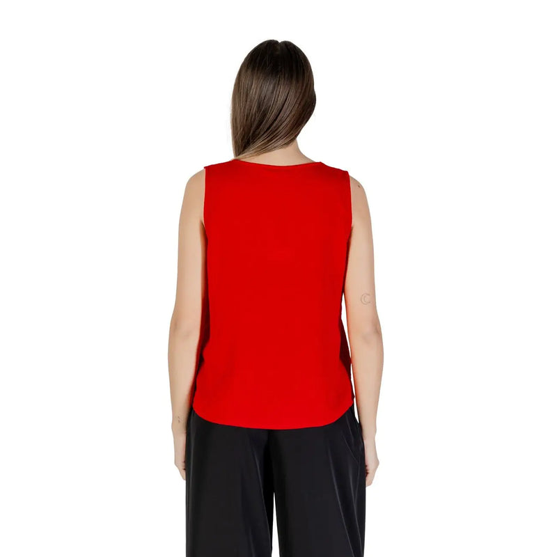 A vibrant red sleeveless polyester tank top for women with a v neck and smooth fitted silhouette