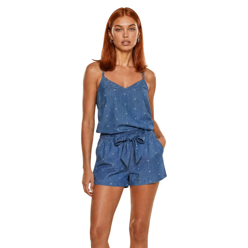 Blue cotton sleeveless v neck tank top styled with a blue denim romper featuring white stars and a tied waistband