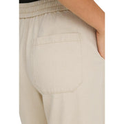Beige cotton lyocell joggers from only women with a textured fabric, relaxed fit, elastic waistband, and lace details