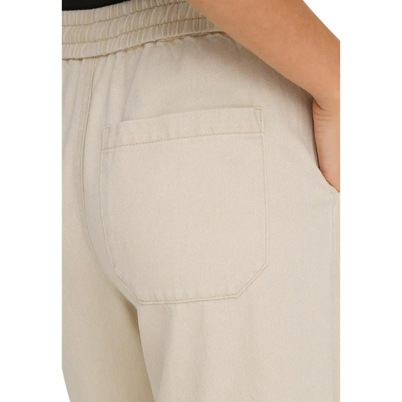 Beige cotton lyocell joggers from only women with a textured fabric, relaxed fit, elastic waistband, and lace details
