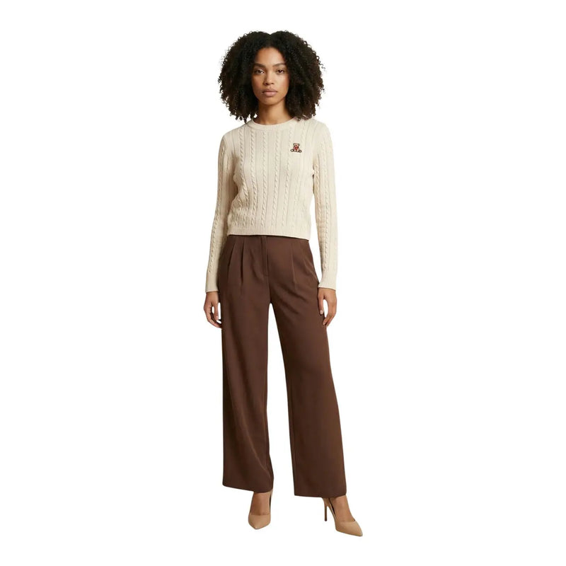 Cream-colored cable-knit sweater with small embroidered logo paired with brown slim fit polyester elastane trousers