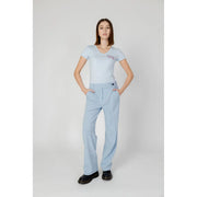 Light blue v-neck short sleeve polyester t-shirt with small embroidered logo on left chest for women trousers outfit