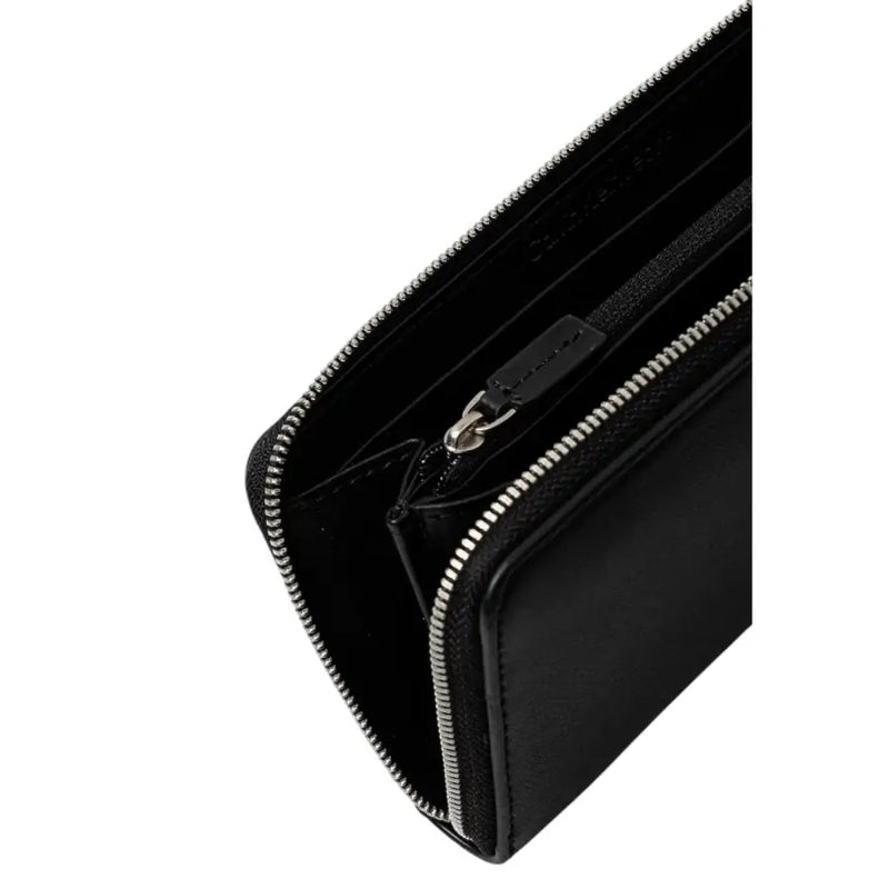 Open black leather wallet with zipper and embossed logo on a white background