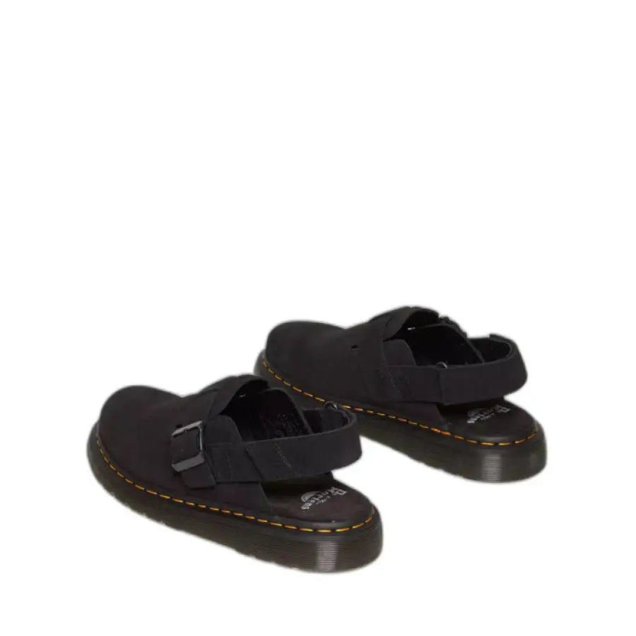 
                      
                        Black Dr. Martens sandals showcasing urban city style on a white background
                      
                    