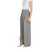Grey women’s wide-leg trousers with belted waist and front zip button pockets