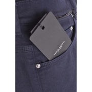 Black rectangular paolo pecora milano tag on the back pocket of blue cotton stretch mens trousers