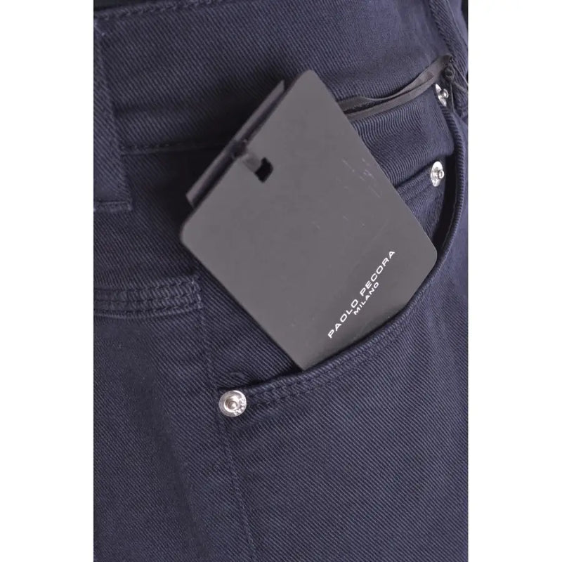 Black rectangular paolo pecora milano tag on the back pocket of blue cotton stretch mens trousers