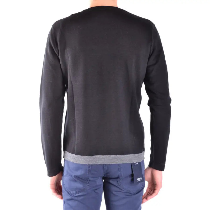 Schwarzer Herren-Strickpullover von Paolo Pecora aus Wolle mit Rundhalsausschnitt, dezenter Strickstruktur und kontrastierendem grauen Rippstricksaum.