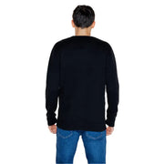 Person wearing a Black Long Sleeved Crewneck Sweater and Blue Jeans