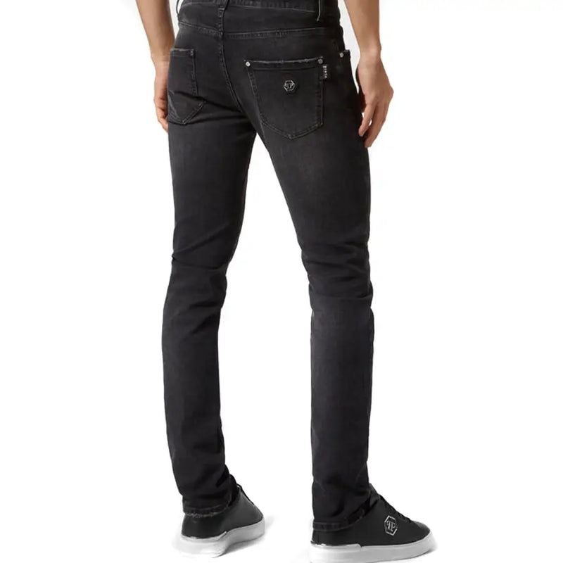 Back side of black slim-fit philipp plein stretch cotton jeans for women with subtle faded wash and silver logo on pocket