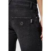 Back side of Philipp Plein black stretch cotton jeans for women featuring a hexagonal logo patch on the pocket