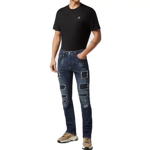 Philipp Plein men blue ripped cotton jeans featuring a worn out effect with dark blue distressed patches and embroidered logo
