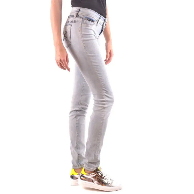 Light wash skinny jeans with metallic sneakers from Philipp Plein Spring Summer Women Blue Jeans