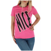 A vibrant pink short-sleeved t shirt with the word nice in bold black letters outlined with sparkling rhinestones