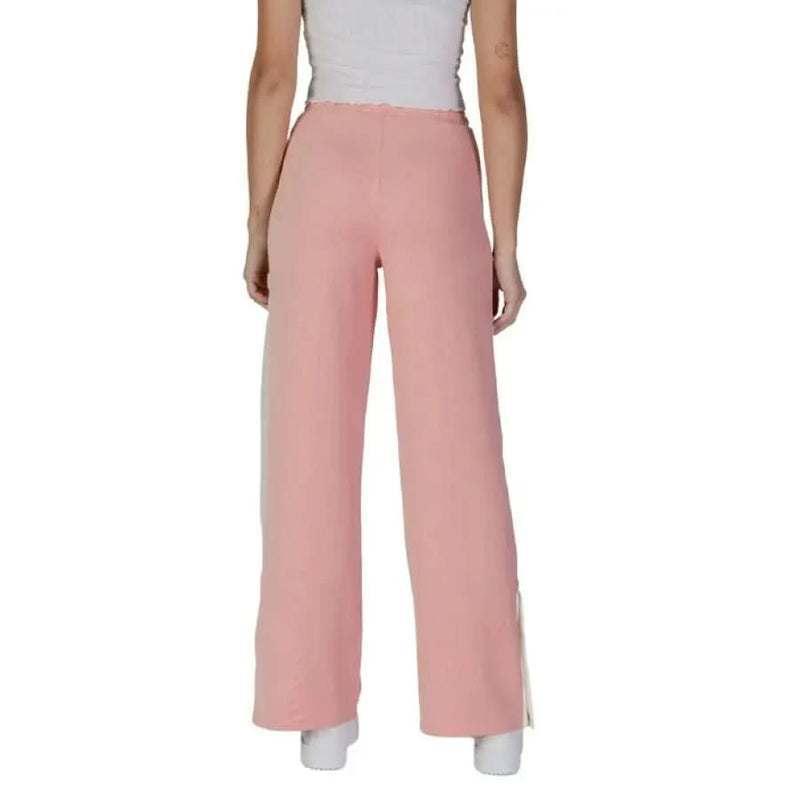 Pink wide-leg pants with white side stripes from Guess Active featuring front pockets