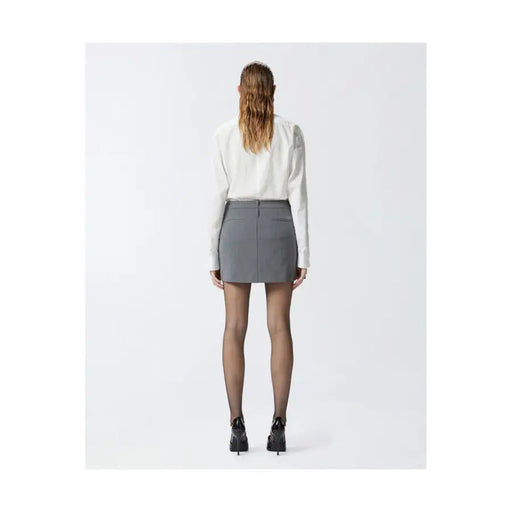 Pinko grey tailored mini skirt with structured waistband and front pockets worn with white blouse and black heels
