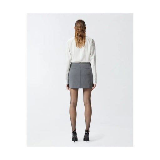 Pinko grey tailored mini skirt with structured waistband and front pockets worn with white blouse and black heels