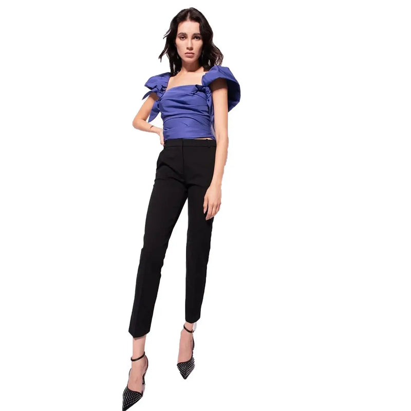 Blue ruffled off shoulder top with satin like fabric and puffed sleeves paired with pinko women black viscose trousers