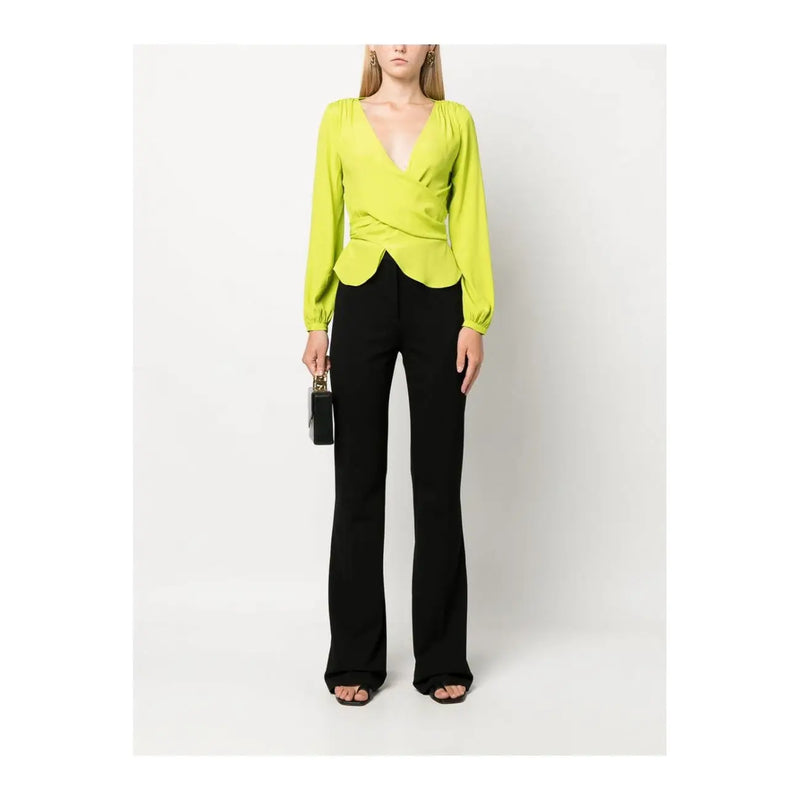 Vibrant lime green viscose wrap blouse with ruched bodice and gathered cuffs paired with pinko slim fit black trousers