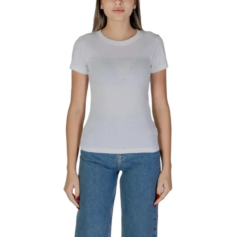 Plain white crew neck cotton t-shirt styled with blue jeans from Calvin Klein Jeans