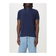 Navy blue polo shirt with short sleeves and a classic collar, featuring a small embroidered logo on the left chest.