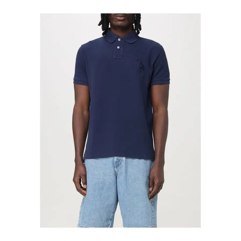 Navy blue polo shirt with short sleeves and a classic collar, featuring a small embroidered logo on the left chest.