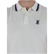 Cream-colored cotton psycho bunny men polo shirt with navy pink collar trim and black embroidered logo short sleeve