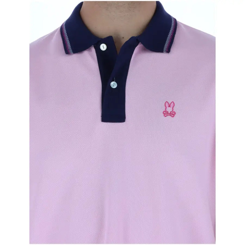 Psycho Bunny men polo shirt pink short sleeve cotton with navy blue collar and small embroidered pink bunny logo