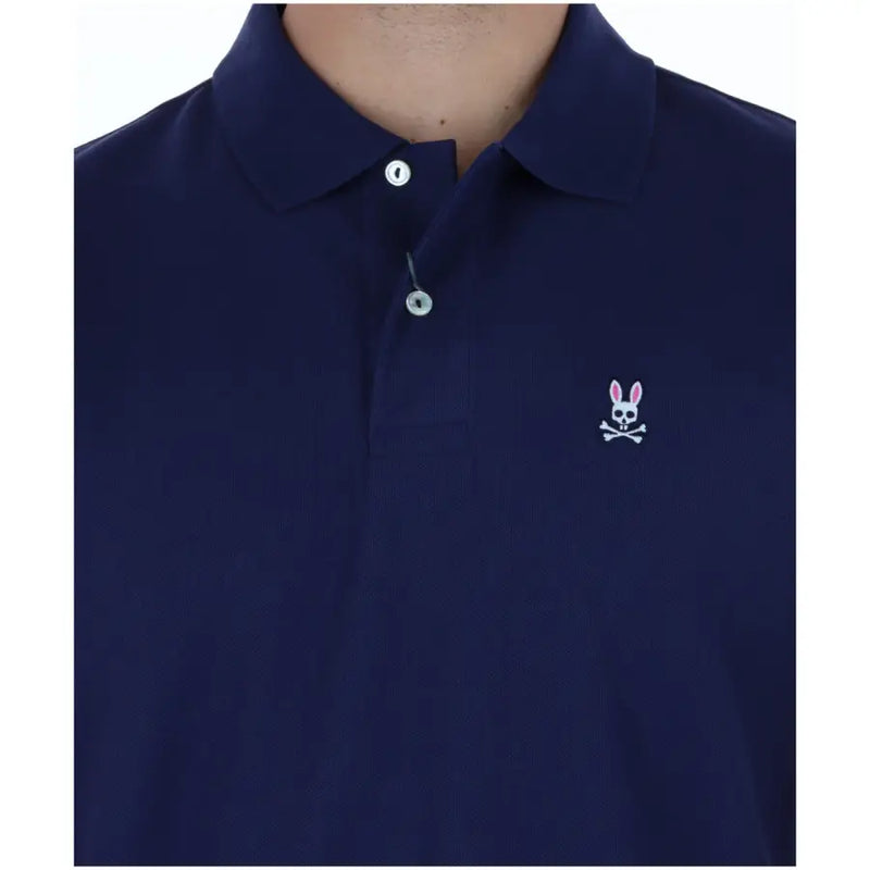 Navy blue cotton Psycho Bunny men polo short sleeve shirt with white embroidered rabbit skull and crossbones logo on chest
