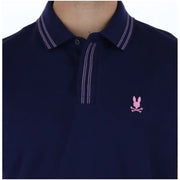 Navy blue Psycho Bunny men polo short sleeve cotton shirt with white double-stitching and pink embroidered logo