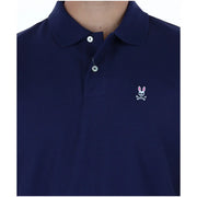 Psycho Bunny polo for men in navy blue with white embroidered rabbit skull and crossbones logo, front view