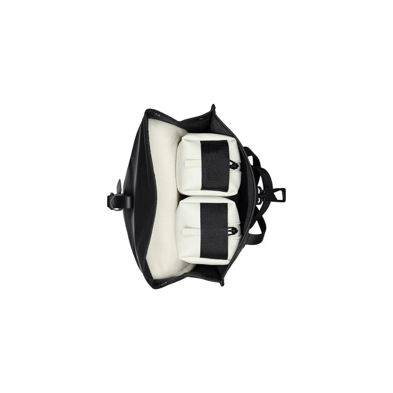 Black leather rains men backpack mini with two white padded compartments and black webbing straps for camera gear