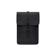 Rains unisex mini backpack in black waterproof material with sleek matte finish and simple flap closure