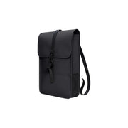 Rains unisex backpack mini in black with a sleek matte finish and adjustable shoulder strap shown from the back side