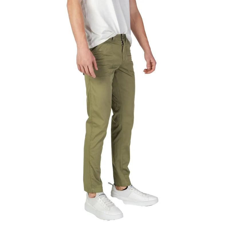 Olive green slim-fit chino pants made of cotton stretch fabric by refrigiwear for men shown from the back side