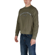 Olivgrünes Baumwoll-Sweatshirt mit Rundhalsausschnitt von Refrigiwear und der Aufschrift „Refrigerwear 1954“ auf der Brust.