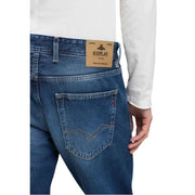 Replay jeans MA972 for men in blue denim with tan leather brand patch and gold stitching, back view