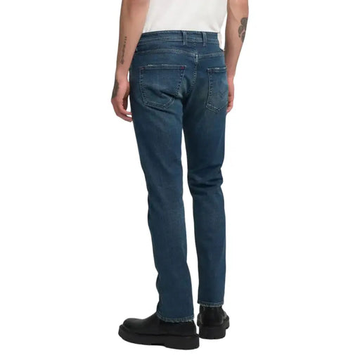 Blue denim jeans with a slim fit and classic five-pocket design.