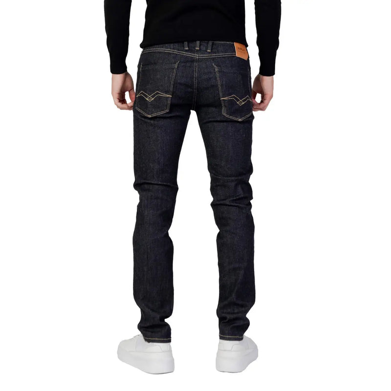 Dark indigo Replay men blue slim fit denim jeans with white stitching and brown leather patch on waistband back side