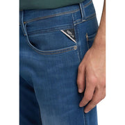 Back side of replay men jeans blue slim fit denim with subtle fade and triangular brand tag on pocket spring summer