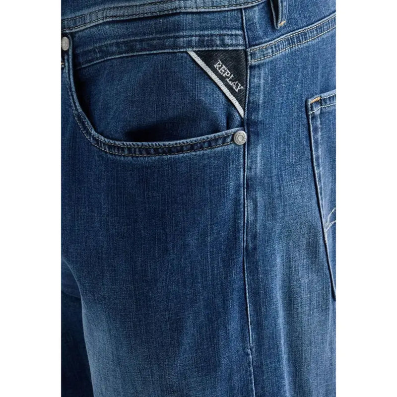 Back side of replay men straight leg jeans in dark blue stretch cotton denim with subtle faded wash and branded back pocket patch