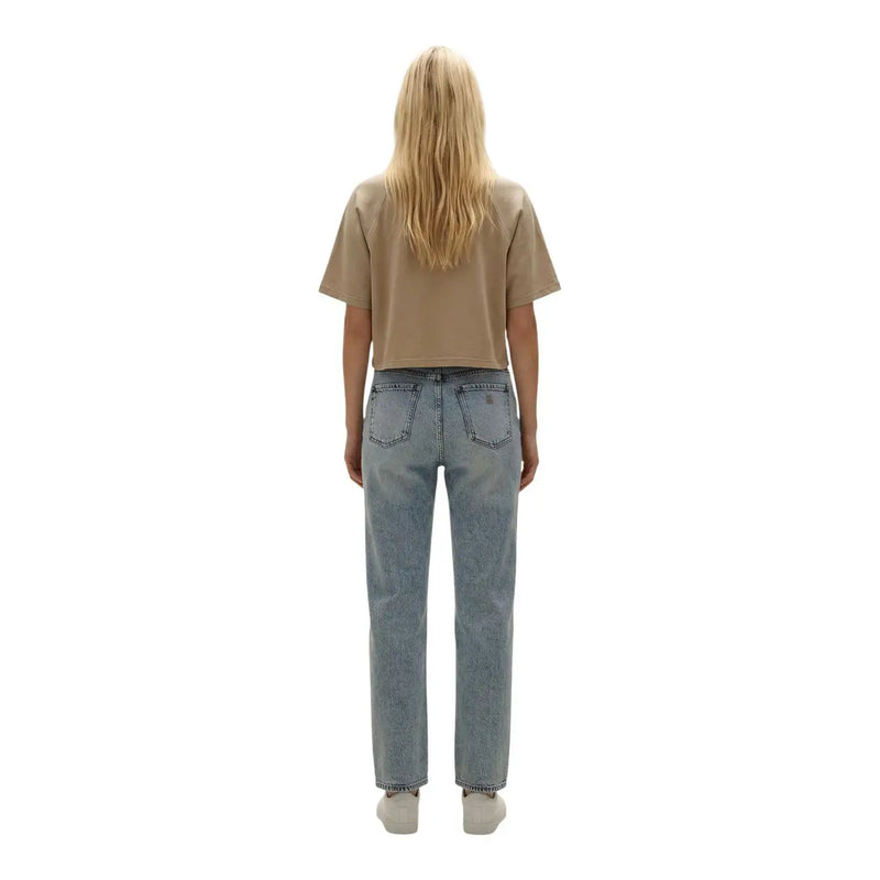 Light-wash denim jeans with straight-leg cut and classic back pockets shown with replay women beige cotton round neck t shirt