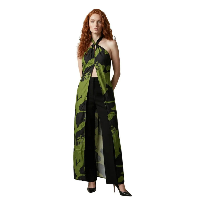 A woman wearing a replay women floral v neck strap summer dress in white with a sheer green and black leaf-patterned overlay