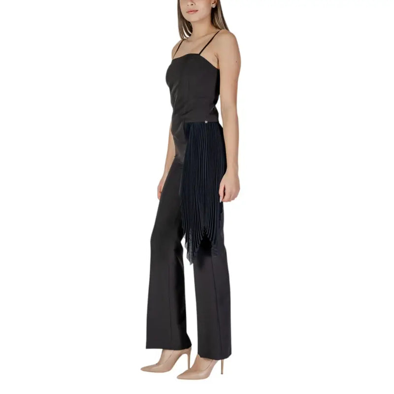 Black pleated side-tie wide-leg trousers with sleek modern design paired with rinascimento black sleeveless dress with square neckline