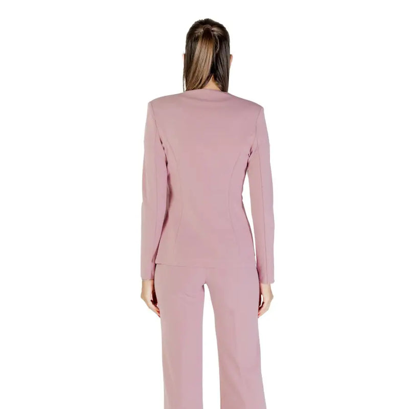 A sleek blush-pink tailored Rinascimento long blazer with rhinestone buttons and matching trousers in structured fabric