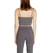 A sleek dark gray Rinascimento women tank top with thin straps and sweetheart neckline paired with high-waisted pants